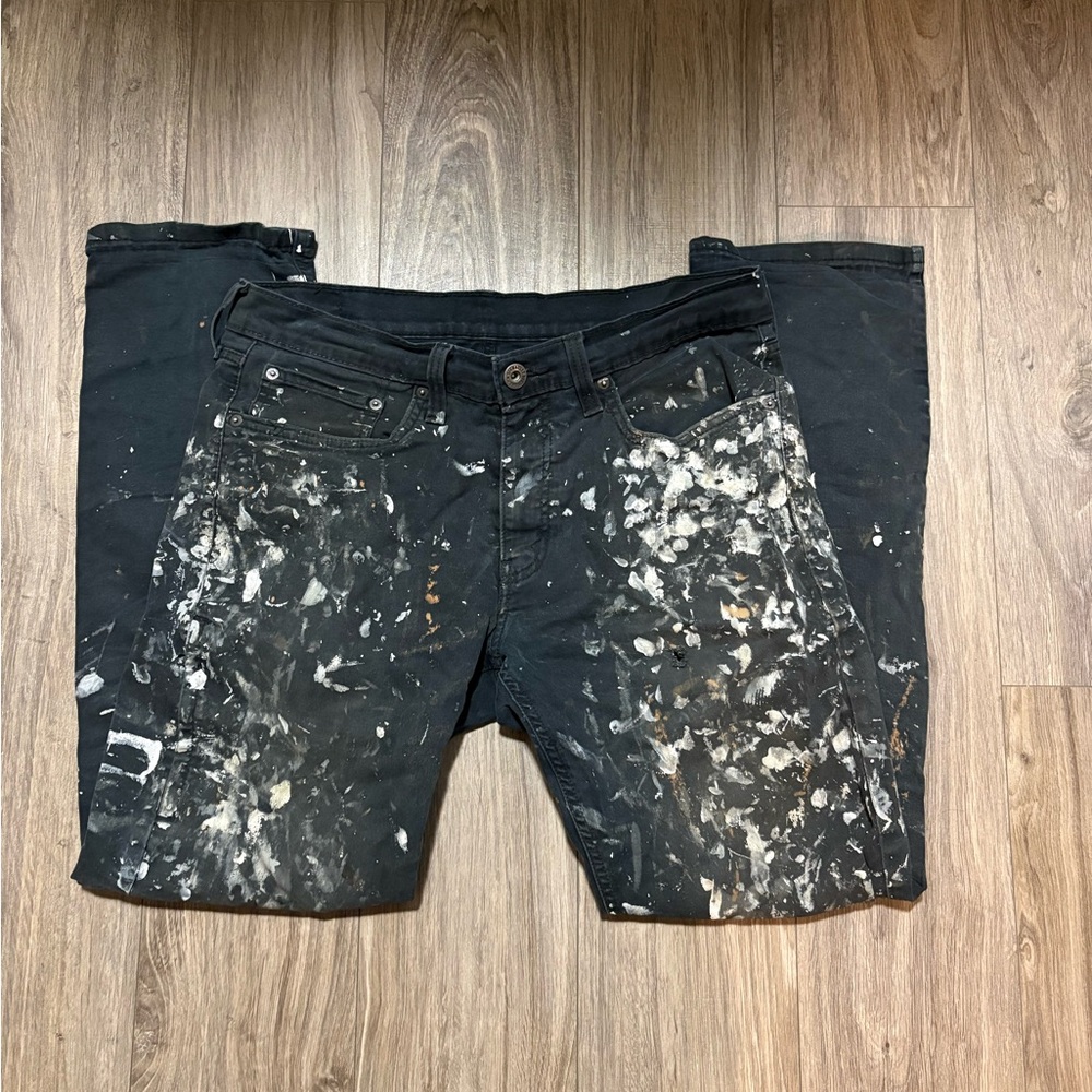 Levi’s Black Paint-Splattered slim straight jeans